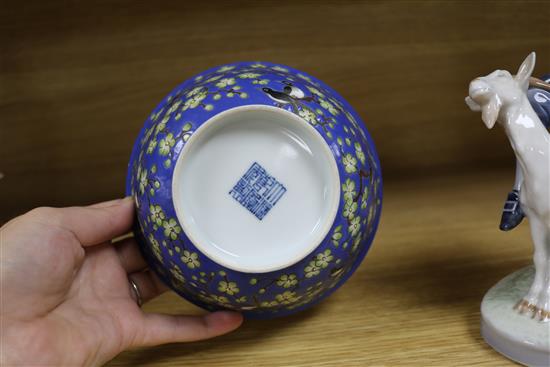 A Chinese blue ground prunus and blackbird bowl, bearing Qianlong mark to the base, diameter 14cm